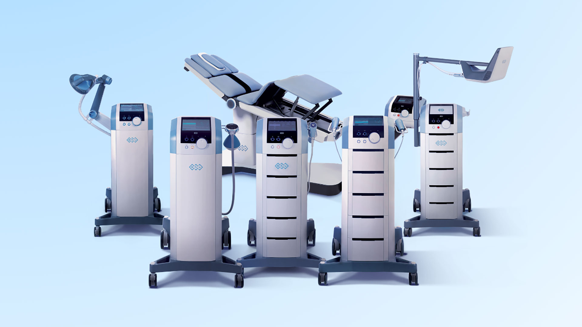 Row of modern anesthesia/medical ventilator machines on wheeled carts against a pale blue background.