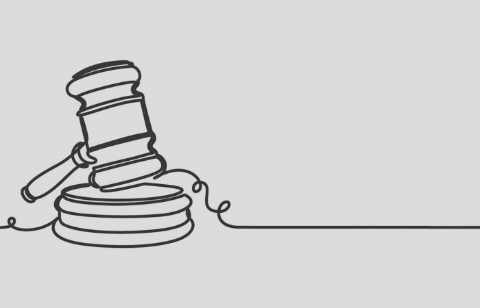 Line drawing of a judge's gavel resting on a sound block with a curling cord trailing to the side.