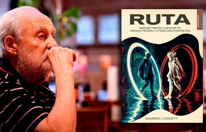 Older man with white hair rests his chin on his hand, looking at a large science fiction book cover titled RUTA.